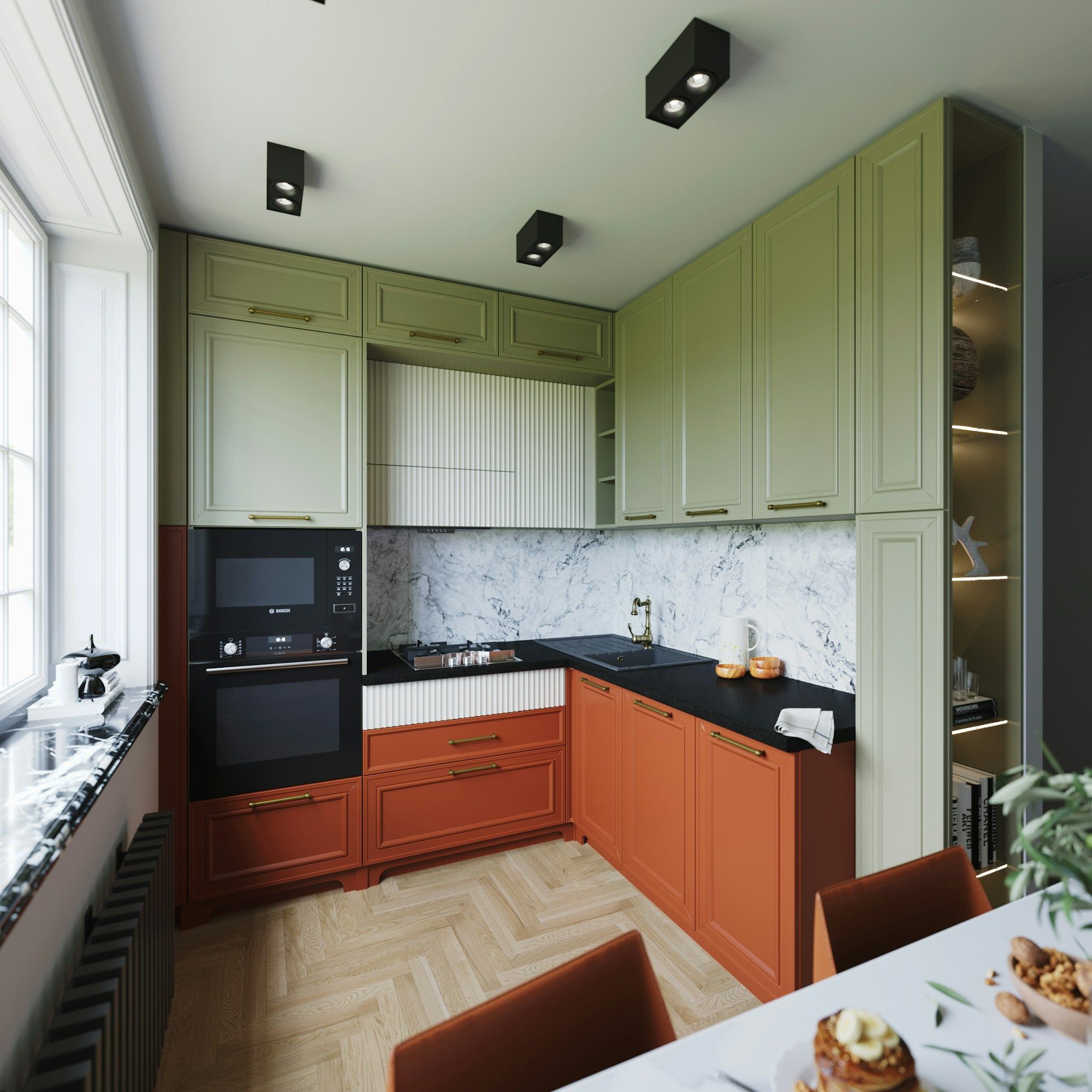 Cocina con muebles altos verdes, bajos en tono terracota y encimera oscura, iluminada con luz natural
